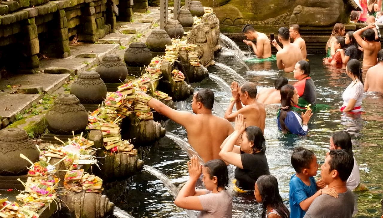 Purification in Tirta Empul Water Temple.jpg